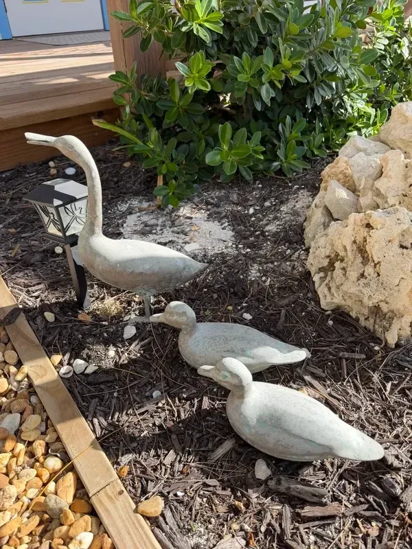 Duck sculptures in the garden at Blue Moon Cottage
